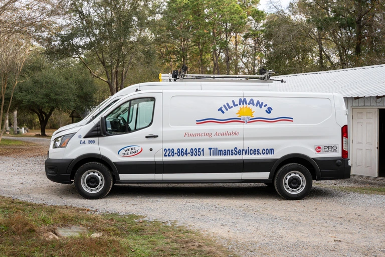 Tillman's Services van parked on a gravel driveway, featuring contact information and financing options, emphasizing local air conditioning installation expertise in Gulfport, MS.